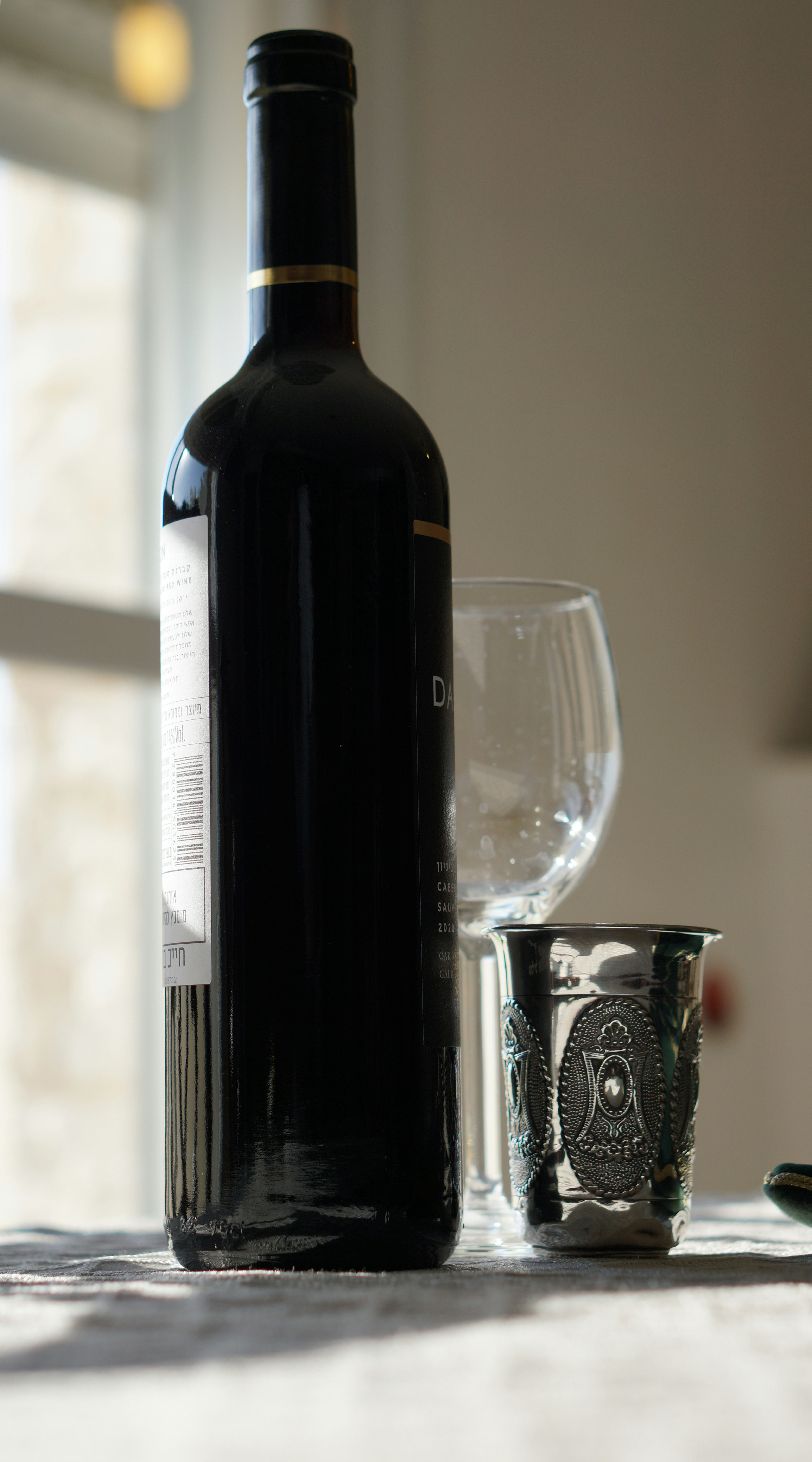 A glass and bottle of wine